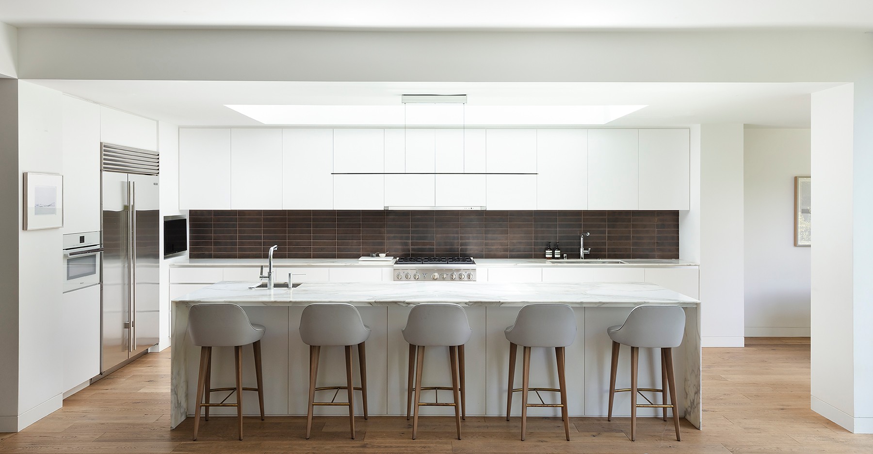 Anders brand wordmark in white placed on top of an image of a modern interior design.