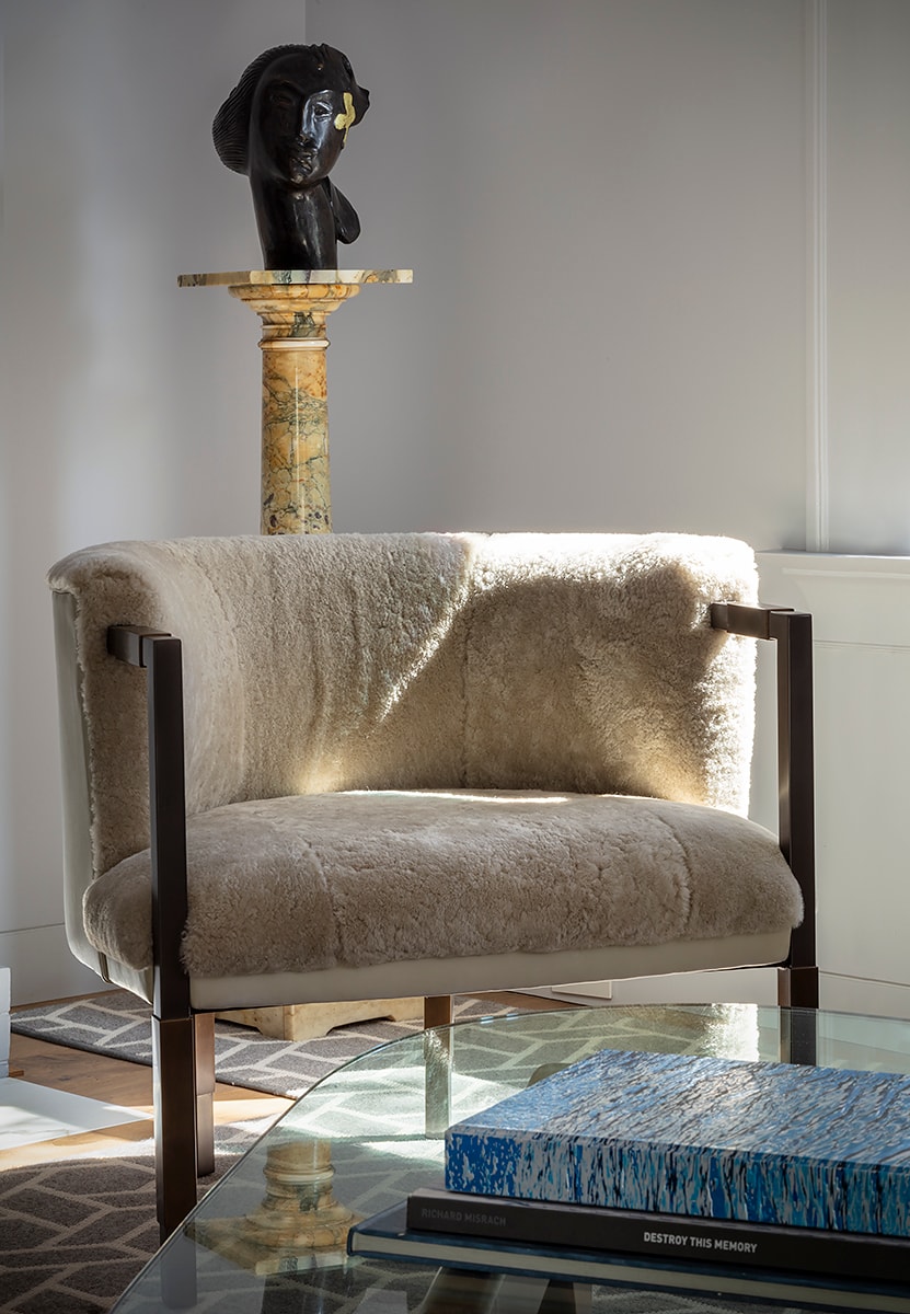 Graphic depicting a hexagonal cropped photo of an interior room design with grid lines along its borders.